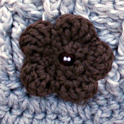 Crochet newsboy with brown flower